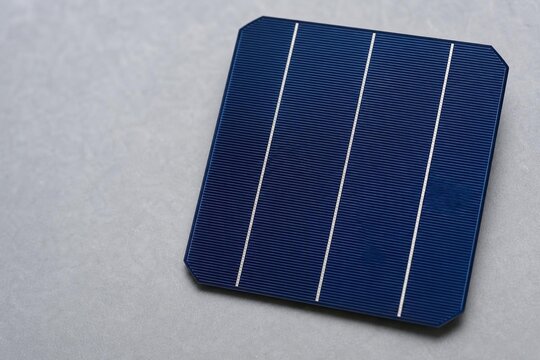 Monocrystalline solar cell wafer close-up, clean energy technology.