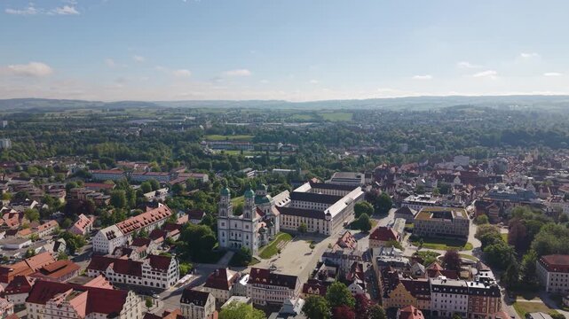 Super wide aerial view of Basilica Saint Lorenz Church and the historic Kempten Allg&auml;u city center in Germany, showcasing Bavarian architecture and the urban landscape from above. UHD.