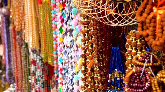 Colorful and vibrant items with spiritual threads and prayer beads at Kamakhya Temple market place 2