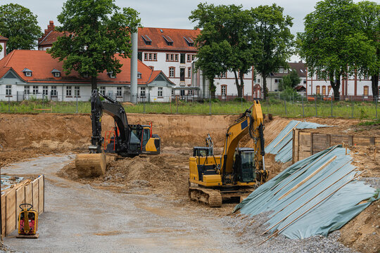Construction site with excavators working in urban area