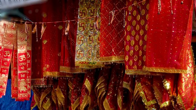 Chunris and devotional cloths with inscriptions of Jai Maa Kamakhya at Maa Kamakhya temple marke