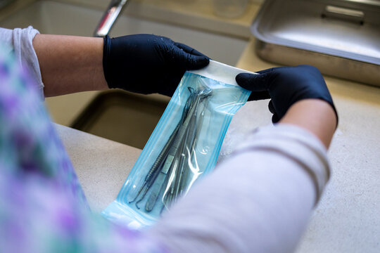 Dental Instruments Being Sealed in Sterilisation Pouch