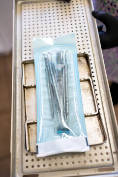 Sterilised Dental Instruments Sealed in Autoclave Pouch on Tray