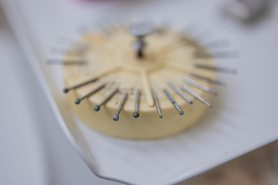 Dental Drill Bits Organised in Round Holder at Dentist Surgery