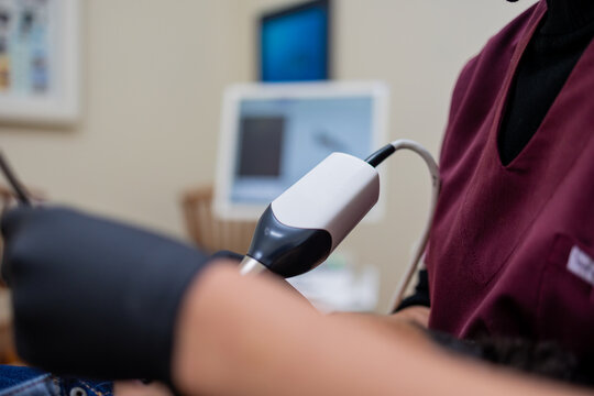 Dental Intraoral Scanner Used on Patient in Dentist Chair