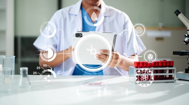 A scientist in a modern laboratory analyzing DNA and medical data on a digital tablet. Features