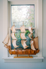 Detailed model sailing ship displayed in window © VolodymyrNadtochii