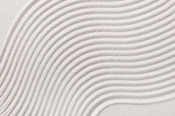 Zen garden sand texture with wavy lines, abstract pattern for relaxation, meditation, and serenity background © Pixel-Shot