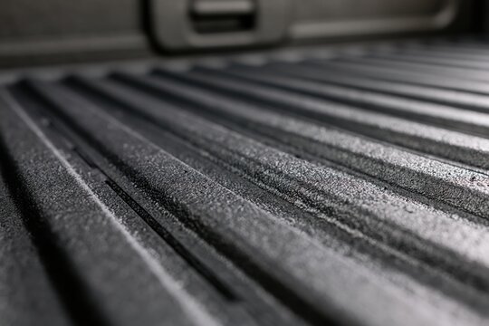 The Truck Bed Closeup Rugged Metallic Grooves and Textured Detail