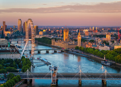 Aerial view of the skyline of London, England, with Southbank and Embankment, Westminster Palace during a golden summer sunrise