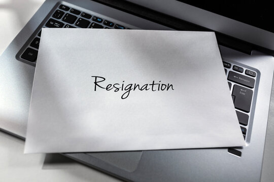 Resignation letter envelope placed on laptop computer keyboard