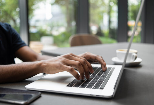 Male hands typing on computer keyboard closeup, business man or student using laptop at home, online learning, internet marketing, people working office workplace, freelance concept