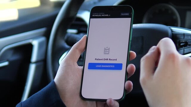 Hands holding a phone with a Clinical Portal open inside a car. The display shows a patient ID and a clear prompt to load diagnostic data. Ideal for illustrating remote medical access, mobile