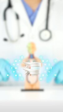 3D rotating vertebrae and disc. Bokeh effect background. Back health, traumatology, prevention of herniated discs, sciatica, lumbago, and preventative care.