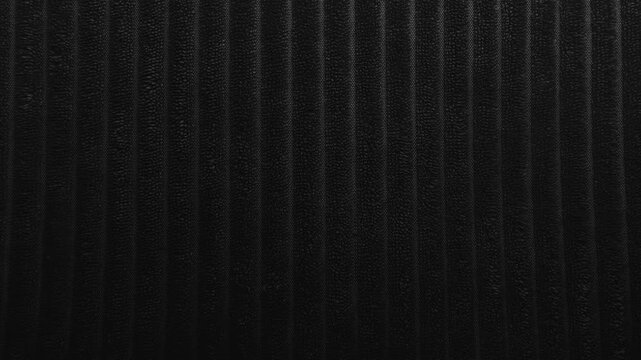 dynamic neon led light illuminates ribbed textured wall surface shifting through vibrant pink blue violet red tones