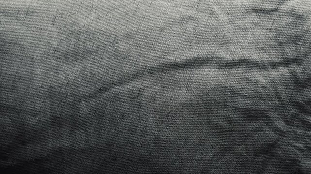 dynamic led color shifts illuminate textured fabric as abstract neon glow morphs over wrinkled cloth surface