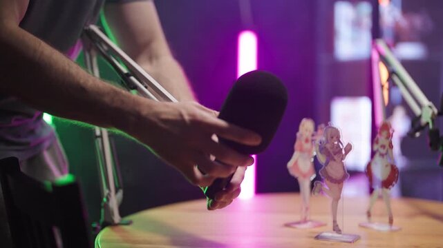 Setting up podcast set with microphone on table arm 4K