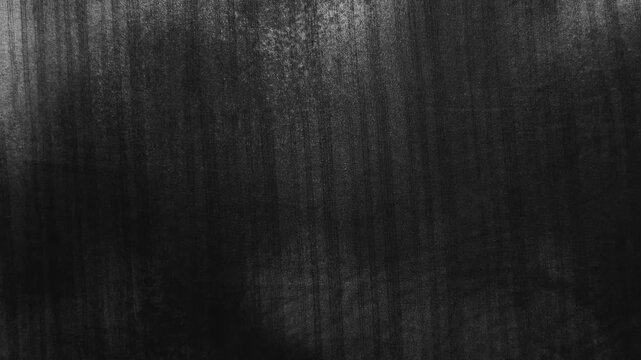 cinematic macro tracking shot reveals shifting light cascading across a dramatic black linen curtain texture