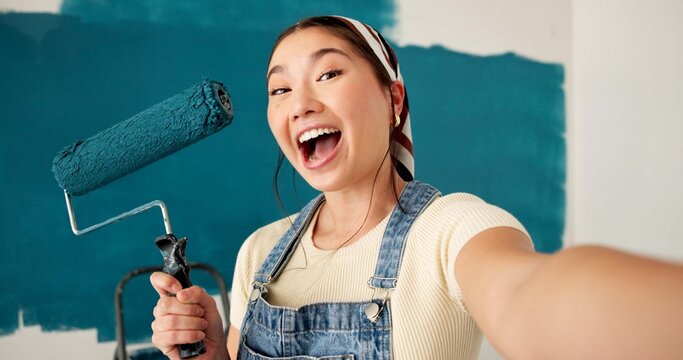 Selfie, painting and portrait of asian woman in home for renovation, diy project and social media. Profile picture, property development and remodeling process with person and roller in apartment