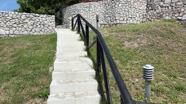 Stone steps and retaining wall on a slope