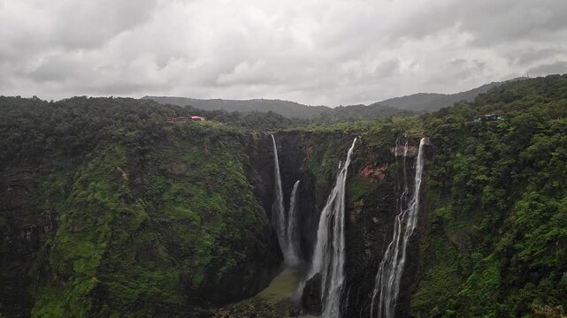 A wide view of Jog Falls showcasing cascading water and scenic natural landscape during monsoon