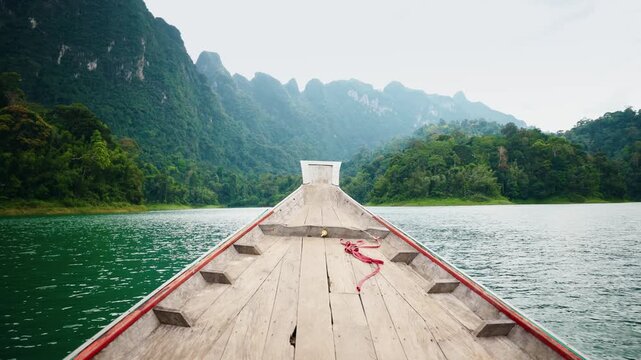 Khao Sok national park in Thailand, scenic limestone cliffs, serene waters.