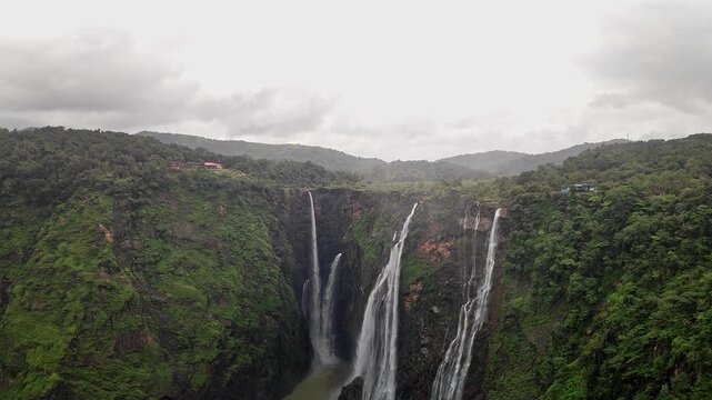A wide view of Jog Falls showcasing cascading water and scenic natural landscape during monsoon