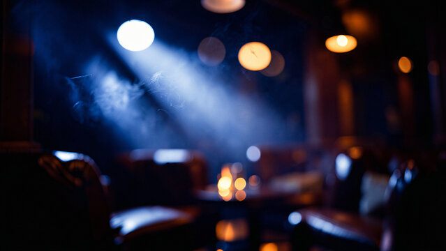 Matte Black Slate Table Surface on Chic Rooftop Lounge with Ambient Warm Uplighting Luxury City Boke