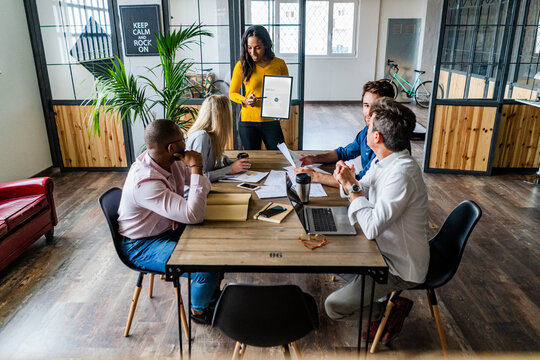 Businesswoman leading a presentation in loft office