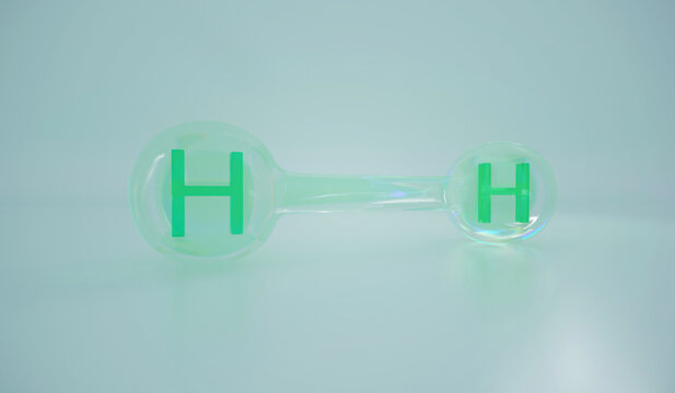 3D render of a green hydrogen H2 molecule on blue background