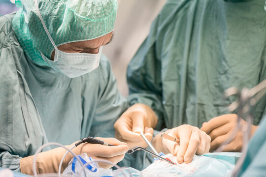 Neurosurgeons opening the cranium during an operation