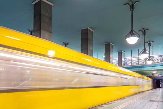 Germany, Berlin, subway station Lindauer Allee with moving underground train