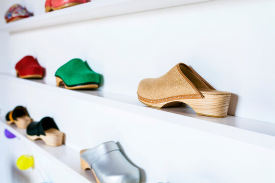 Assortment of clogs on shelf
