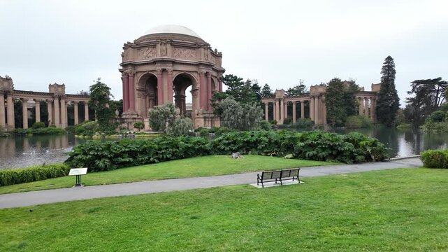 Scenic point of view of the monumental Palace of Fine Arts, a historic landmark in San Francisco, California, with its rotunda and colonnades reflecting on the tranquil lagoon
