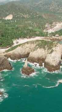 Vertical View Of El Dedo de Dios (Finger of God) Rock Formation At Playa Maruata In Michoac&aacute;n, Mexico. Aerial Shot