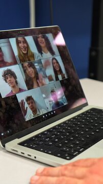 Group of young people waving goodbye during a video call on a laptop screen, ending an online meeting, lesson or webinar. Remote working and smart learning during social distancing