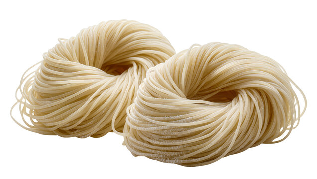 Two nests of uncooked thin spaghetti pasta
