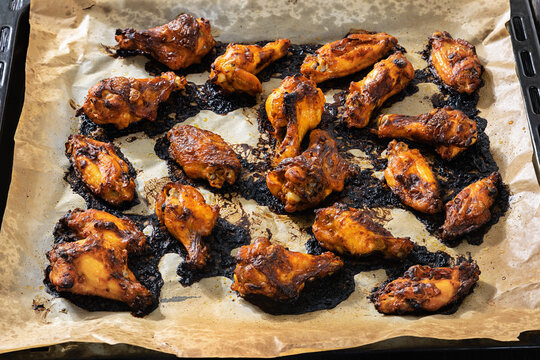 Char-grilled chicken wings on a parchment paper