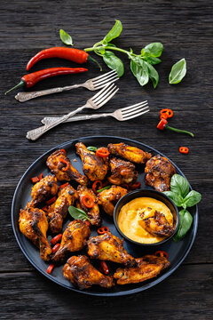 Appetizer chicken wings and creamy dip on a plate
