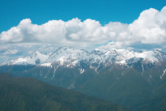 Panoramic view of green Caucasus mountain valley with river and forest - Rosa Khutor, Sochi, Russia