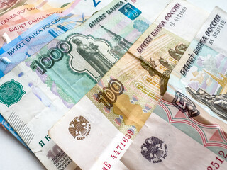 Various denominations of Russian roubles displayed in a close-up arrangement on a surface