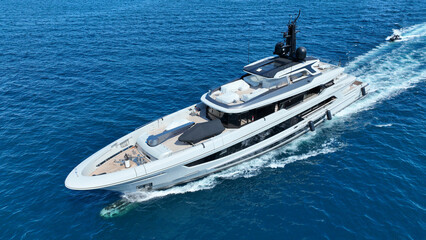 Fototapeta premium Aerial drone photo of luxury yacht cruising in deep blue open ocean Aegean Sea