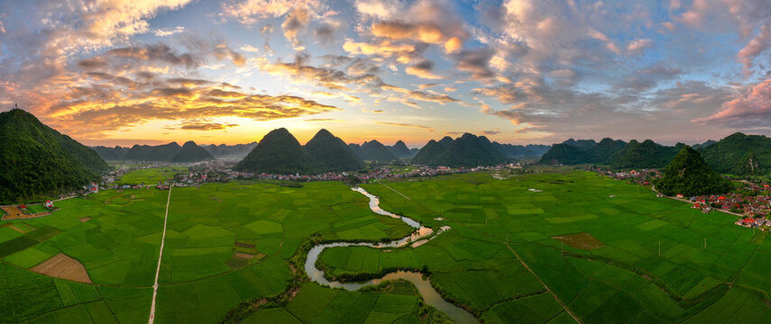 Aerial drone view panorama of Bac Son rice field valley at sunset, Lang Son, Vietnam