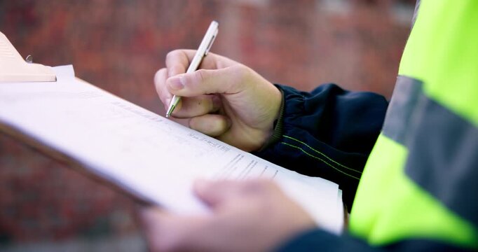 Clipboard, hands and man on construction site for task brief, inspection or safety update. Writing, management and engineer with paperwork, progress report or project coordination for renovation