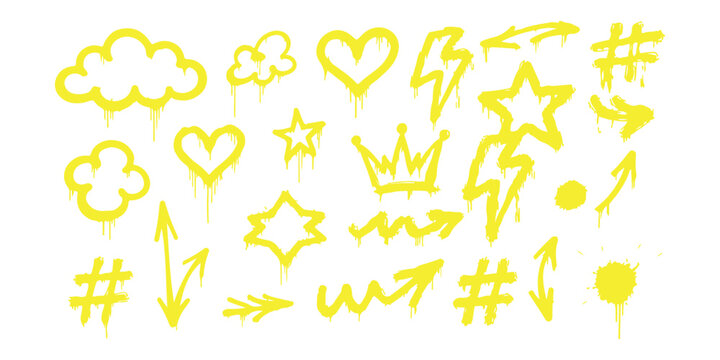 Set of yellow graffiti spray paint elements with hearts stars clouds arrows and crowns