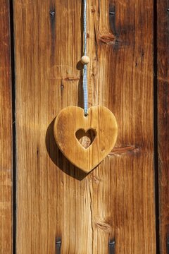 Wooden heart hanging from an alpine hut, Eng-Alm, Karwendel Mountains, Tyrol, Austria