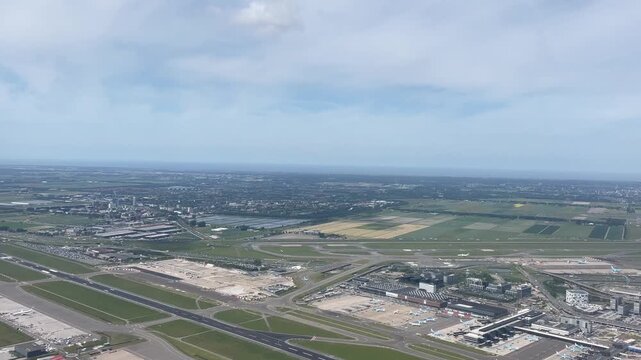 Flying over Amsterdam airport on a sunny day