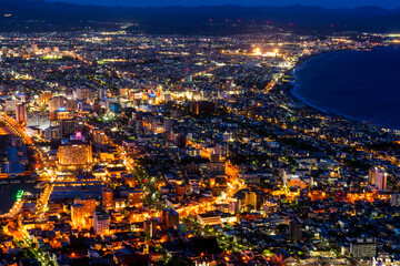 Fototapeta premium Night view of Hakodate from Mount Hakodate, one of Japan's three famous night views, Hokkaido, Japan. Spectacular night view of Hakodate city seen from Mount Hakodate in Hokkaido, Japan.
