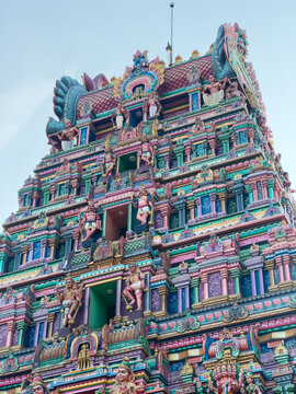 Colorful gopuram of Mailam Murugan Temple in Villupuram district, Tamil Nadu, with intricate Dravidian carvings and deity sculptures.