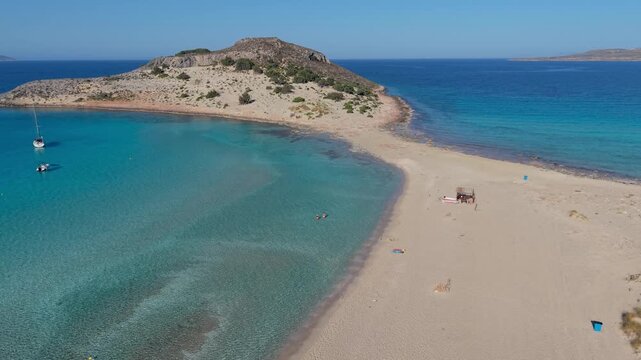 Explore the breathtaking beauty of Simos Beach in Elafonisos, Greece, where golden sands meet crystal-clear waters. Relax under the sun and enjoy the serene landscape at this idyllic getaway.
